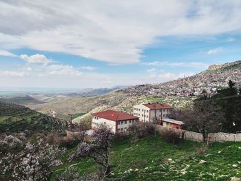 Scenic view of residential buildings against sky