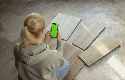 High angle view of woman using mobile phone