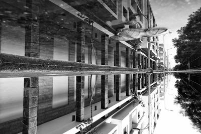 Reflection of buildings on puddle in city