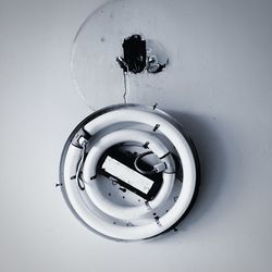 Close-up of circular object on wall