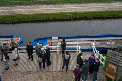 High angle view of people standing on road