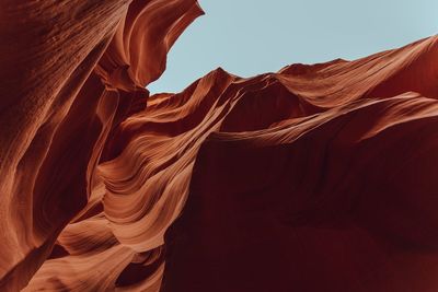 Low angle view of rock formations against sky