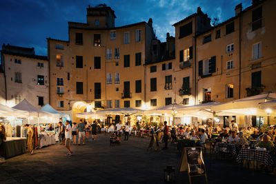 People walking on street at night