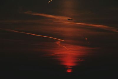 Airplane flying in sky at night