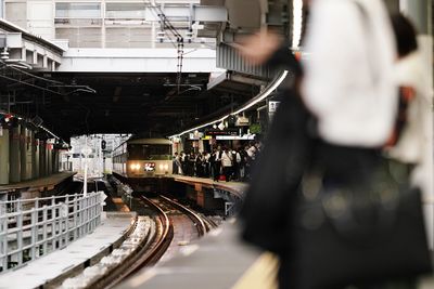 People at railroad station platform