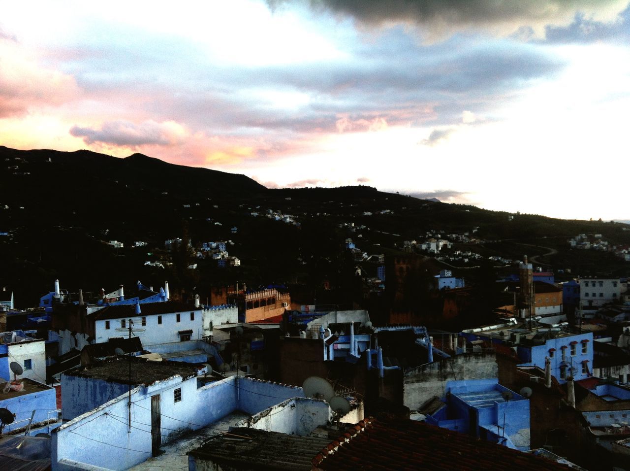 building exterior, architecture, built structure, sky, cloud - sky, house, residential structure, residential building, residential district, mountain, high angle view, town, sunset, townscape, cityscape, city, cloudy, crowded, cloud, dusk