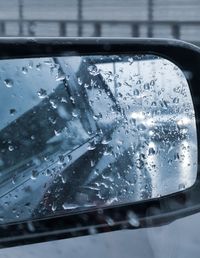 Close-up of raindrops on glass window