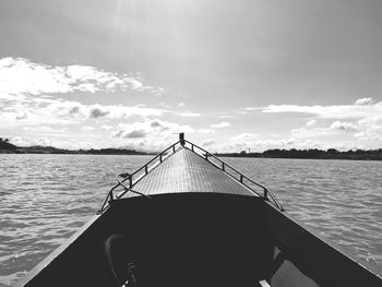 Boat sailing in sea against sky