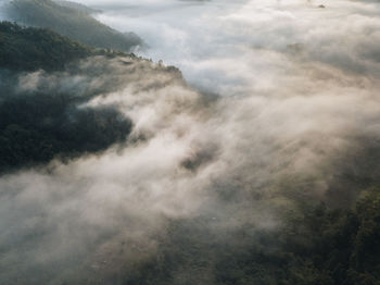 High angle view of mountain against cloudy sky