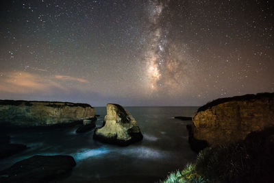 Scenic view of sea against sky at night