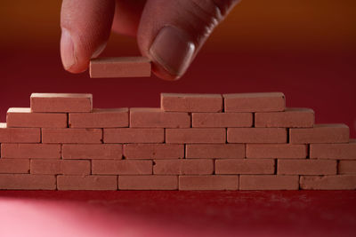 Low section of woman with toy blocks