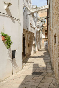 Narrow alley amidst buildings in city