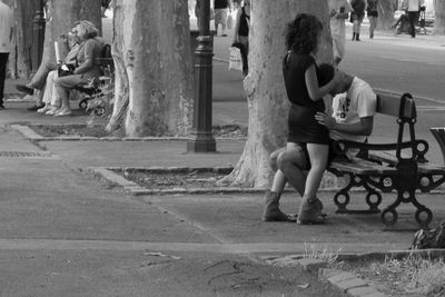 Woman standing on city street