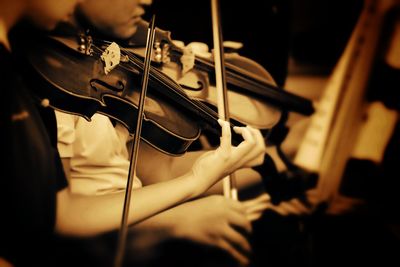 Close-up of people playing guitar