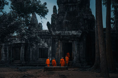 Group of people in temple against building