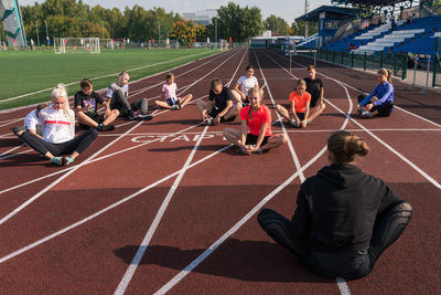 People walking on soccer field