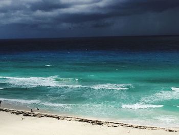 Scenic view of sea against cloudy sky