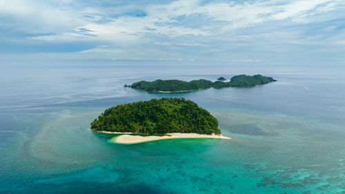 Tropical islands and blue ocean. seascape in the tropics. agutaya and danjugan islands, philippines.