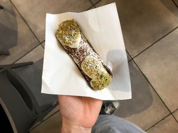 Midsection of person holding ice cream