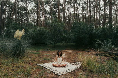 Woman relaxing in forest