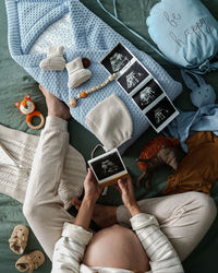 Midsection of woman using mobile phone