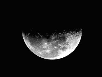 Low angle view of moon against clear sky at night