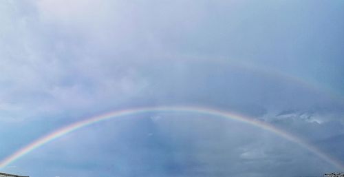 Low angle view of rainbow in sky