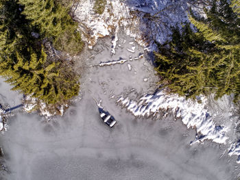 High angle view of road amidst trees during winter