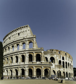 Low angle view of historical building against clear blue sky