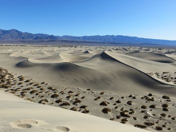 Scenic view of desert against clear sky