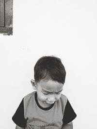 Portrait of boy against wall