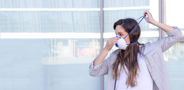 Woman looking away while wearing mask