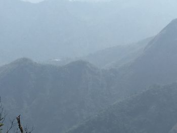 Scenic view of mountains against sky during winter