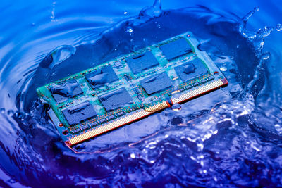 Close-up of computer chip in water