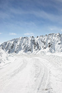 Scenic view of snowcapped mountain against sky