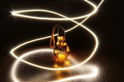 Close-up of illuminated light bulb