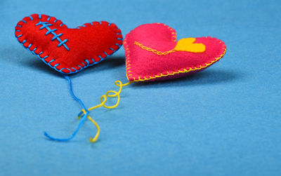 Heart shape decorations on blue background