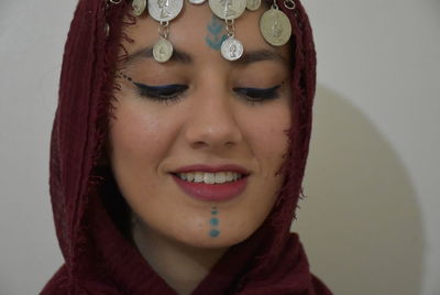 Close-up portrait of a smiling young woman