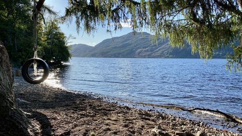 Scenic view of a loch against mountains 