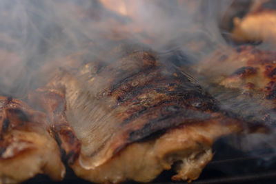 High angle view of meat on barbecue