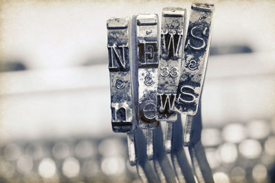 Close-up of text on metal railing