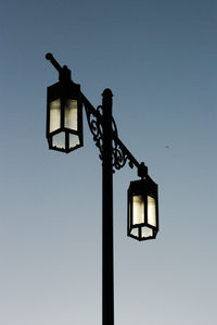 Low angle view of street light against clear sky