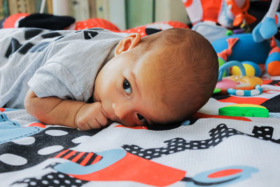 Portrait of cute baby girl with toy