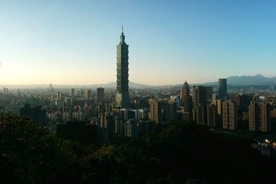 Taipei 101 and city against clear sky