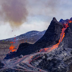 Smoke emitting from volcanic mountain at night