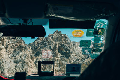 Rocky mountain seen through car windshield