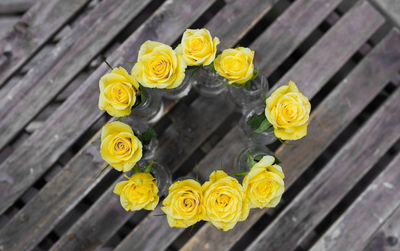 High angle view of yellow flowers on table