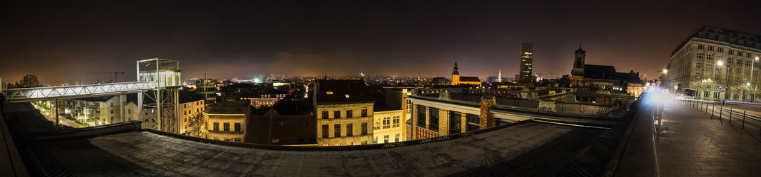 High angle view of illuminated buildings in city at night