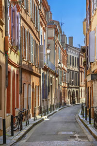 Narrow street in toulouse historical center, france