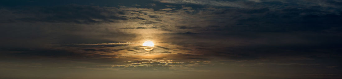 Scenic view of sea against sky at sunset